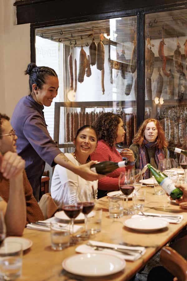 Buenos Aires: Local Foodie Adventure with Sherpa Food Tours - Bodegón comfort food and a glass of Argentine wine